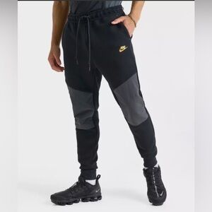Nike Men’s Black Joggers with Gray Knee Panels & Yellow Swoosh
